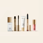 The Full Face Bestseller Set mit Changing Foundation, Primer, Brow Gel, Shimmer Stick und Blush in Gold.