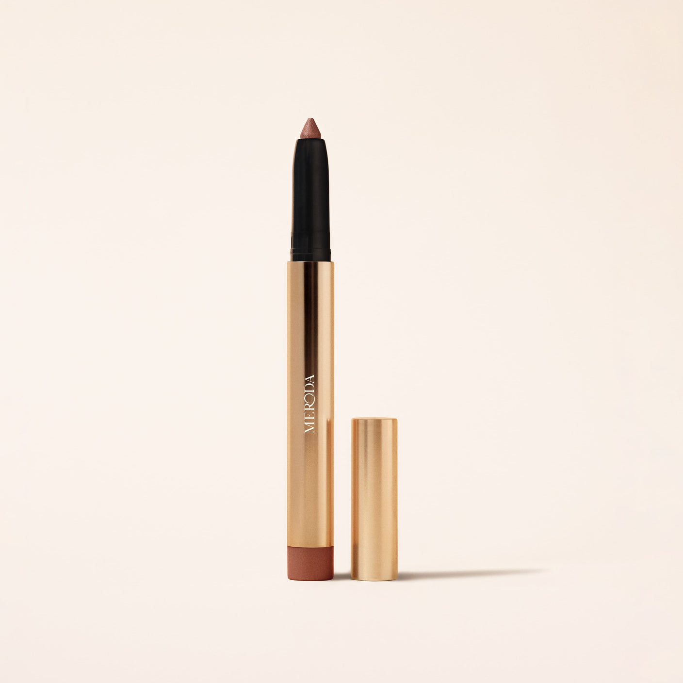 Meroda Cosmetics Eye Perfecting Shimmer Stick in Mauve mit goldener Verpackung