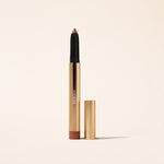 Eye Perfecting Shimmer Stick in Bronze, schimmernder Creme-Lidschatten in goldener Metallhülle auf hellem Hintergrund.