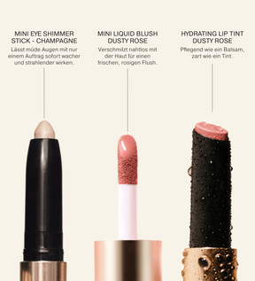 Soft Touch Trio mit Nahaufnahmen des Eye Shimmer Sticks in Champagne, des Liquid Blushes und des Lip Tints in Dusty Rose.