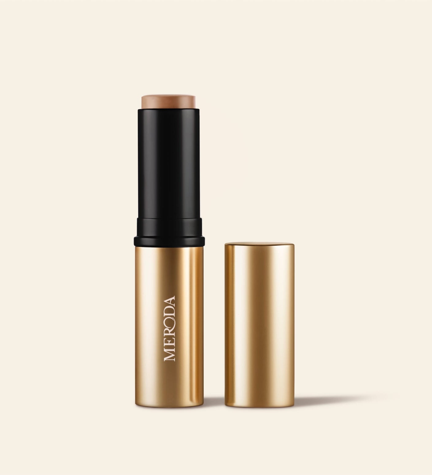 Soft Tan Bronzer in Light mit goldener Verpackung und cremiger Stick-Formel ohne Deckel.