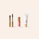 Meroda Minis Set mit Velvet Skin Primer, Vibrant Cheeks Liquid Blush und Gilded Lashes Mascara in Gold.